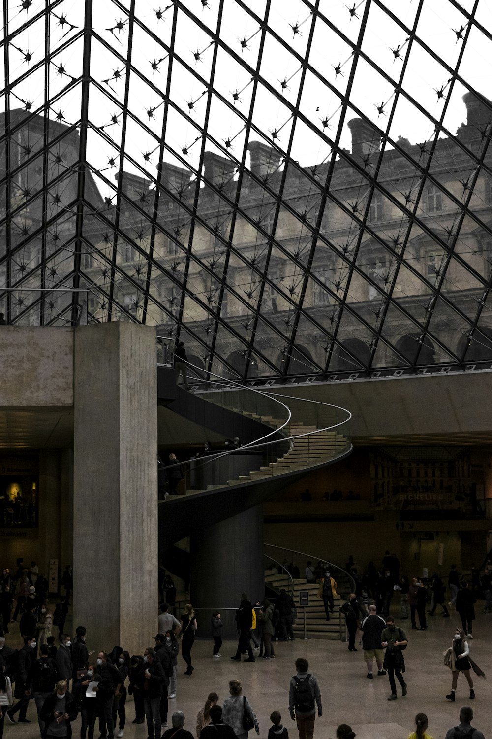 a group of people walking around a building