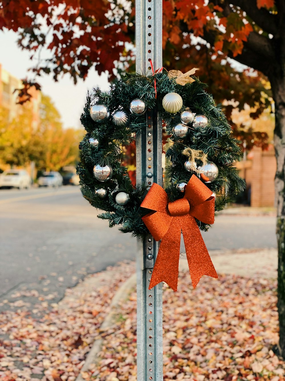 a pole with a wreath on top of it