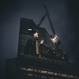 a very tall building with a crane on top of it