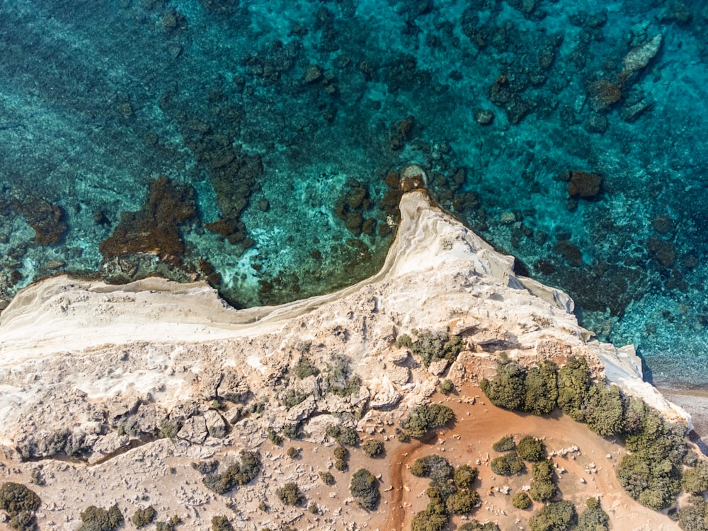 an aerial view of the ocean and land