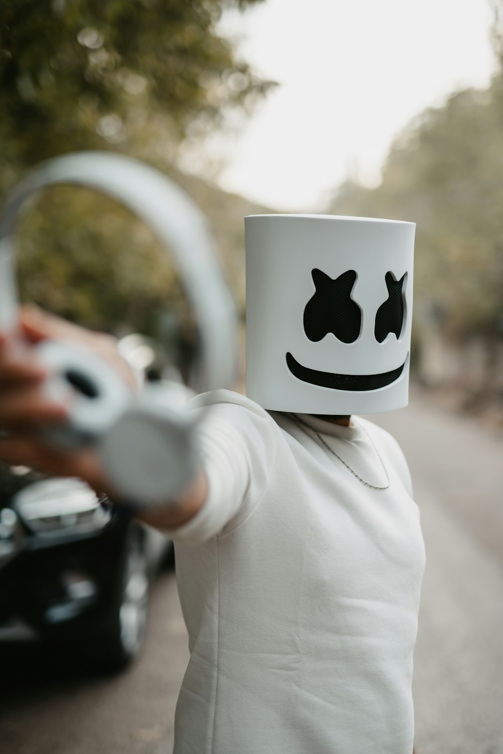 a woman holding a mug with a smiley face on it