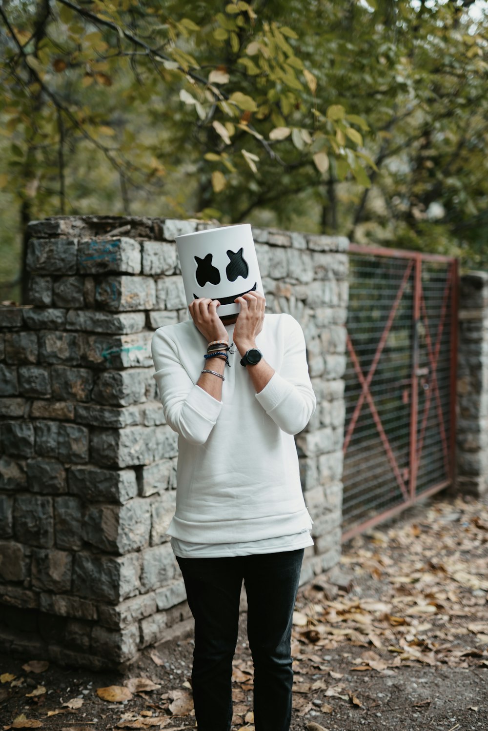 a woman covering her face with a cow mask