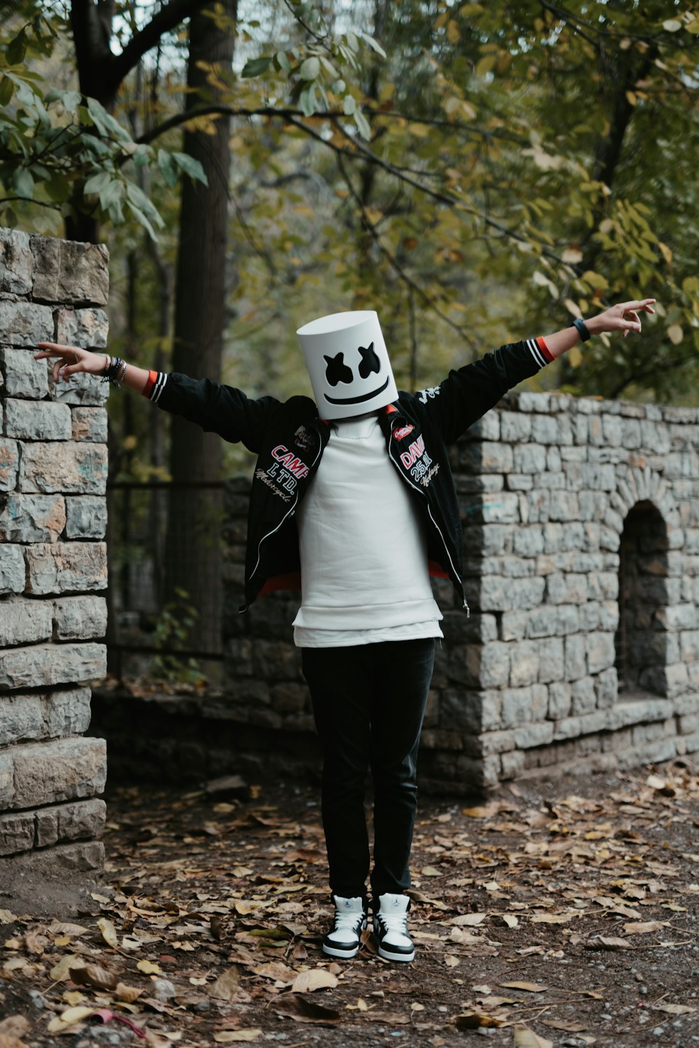 a person wearing a white hat and black jacket