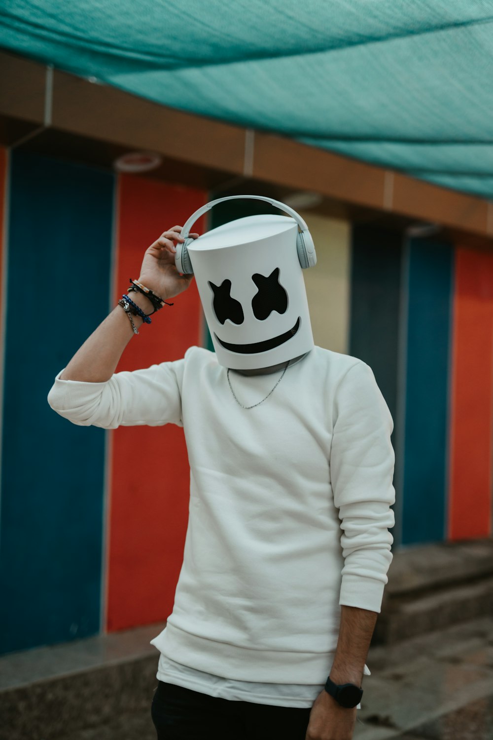 a man wearing a marshmallow hat and headphones