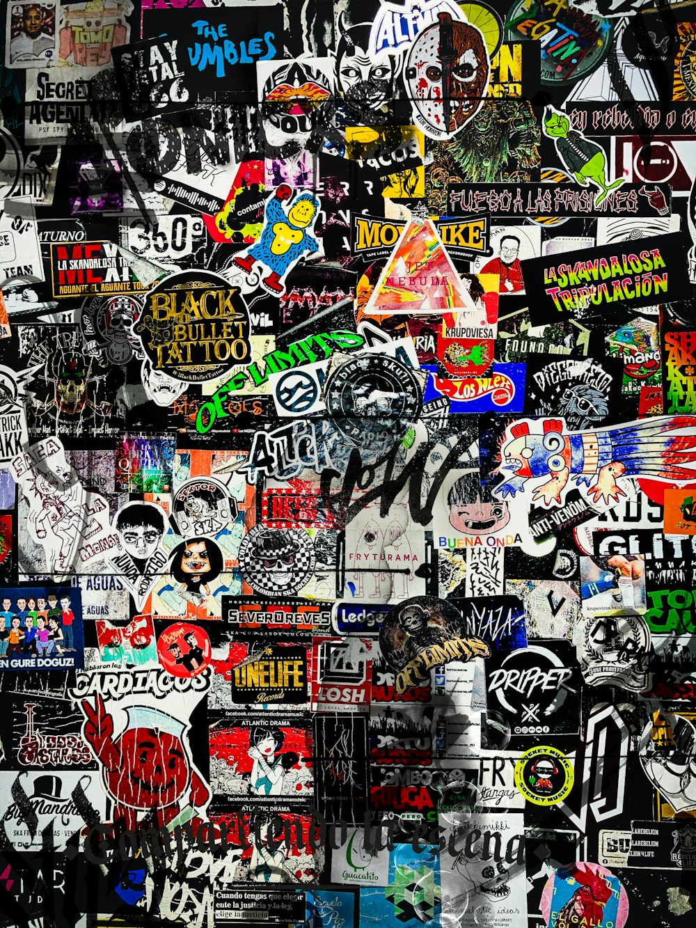 a wall covered in lots of different stickers