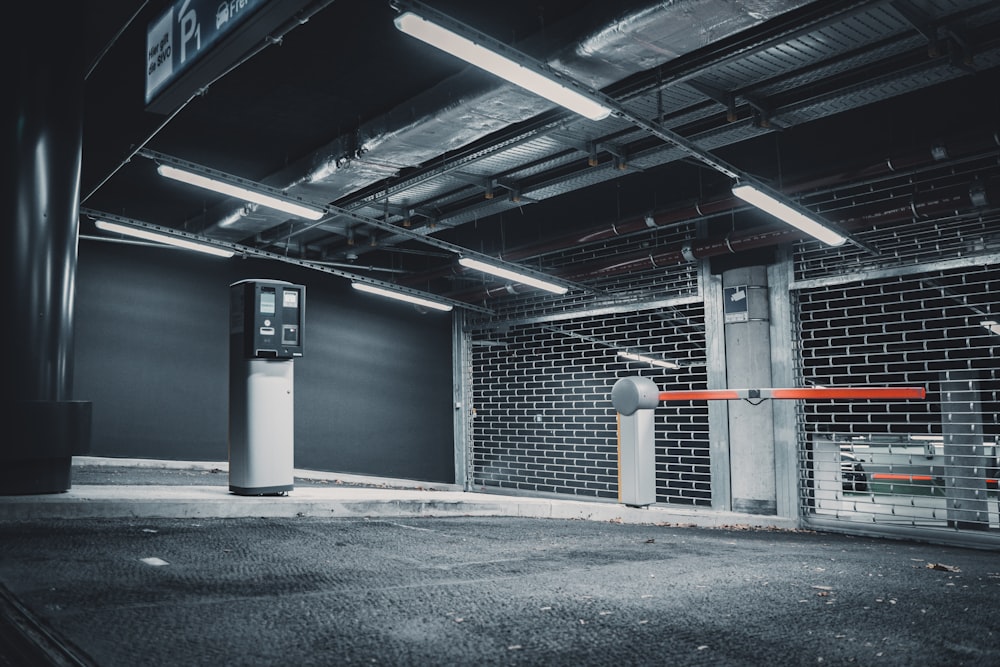 an empty parking garage with a parking meter