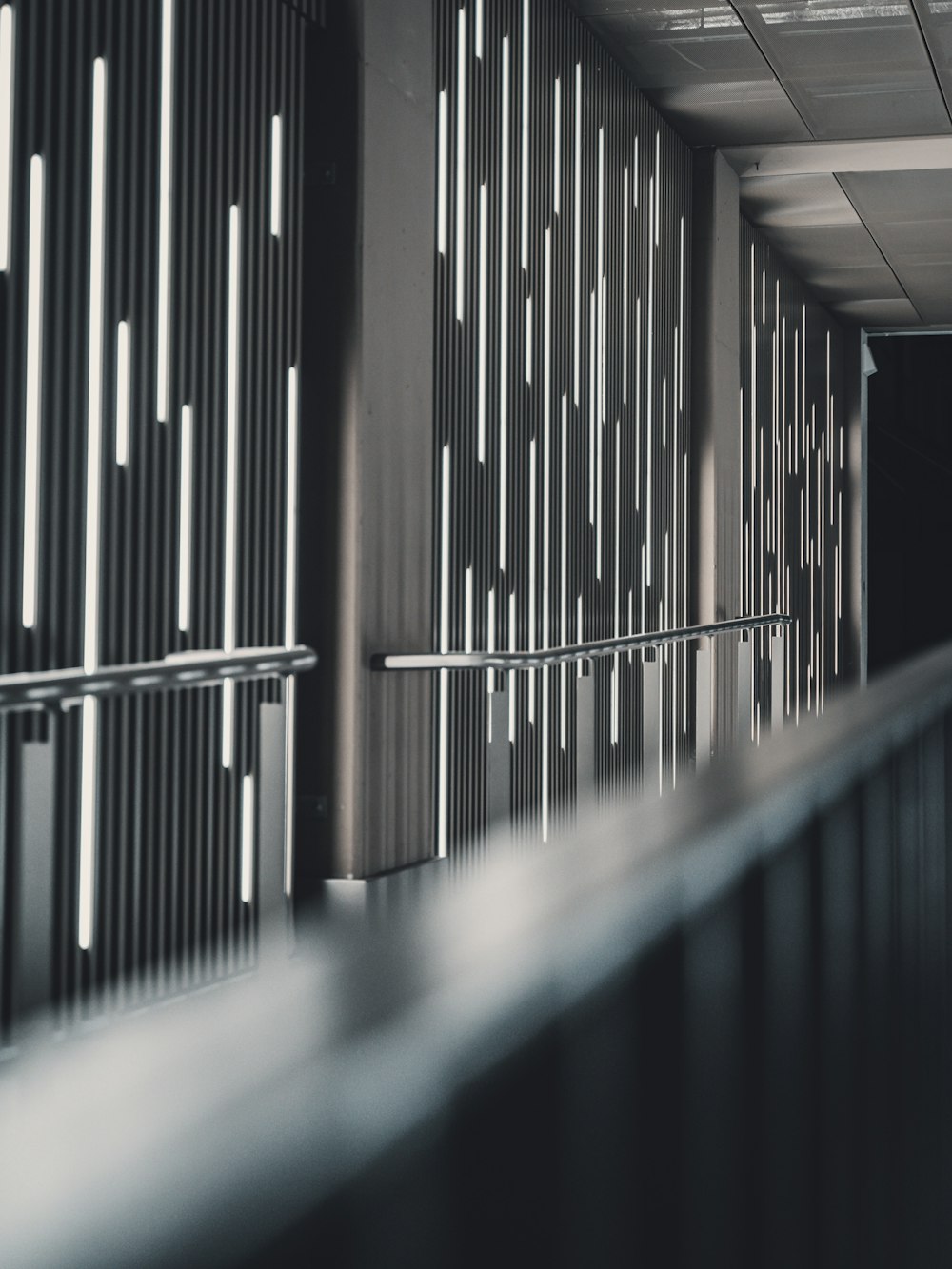 a black and white photo of a hallway