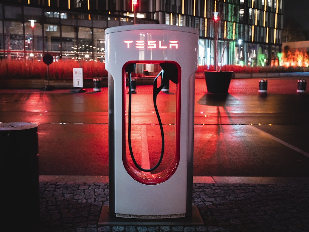 a phone booth sitting on the side of a road