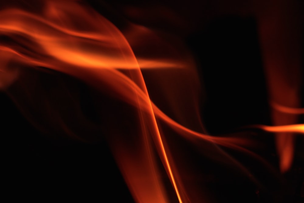 a close up of a fire with a black background