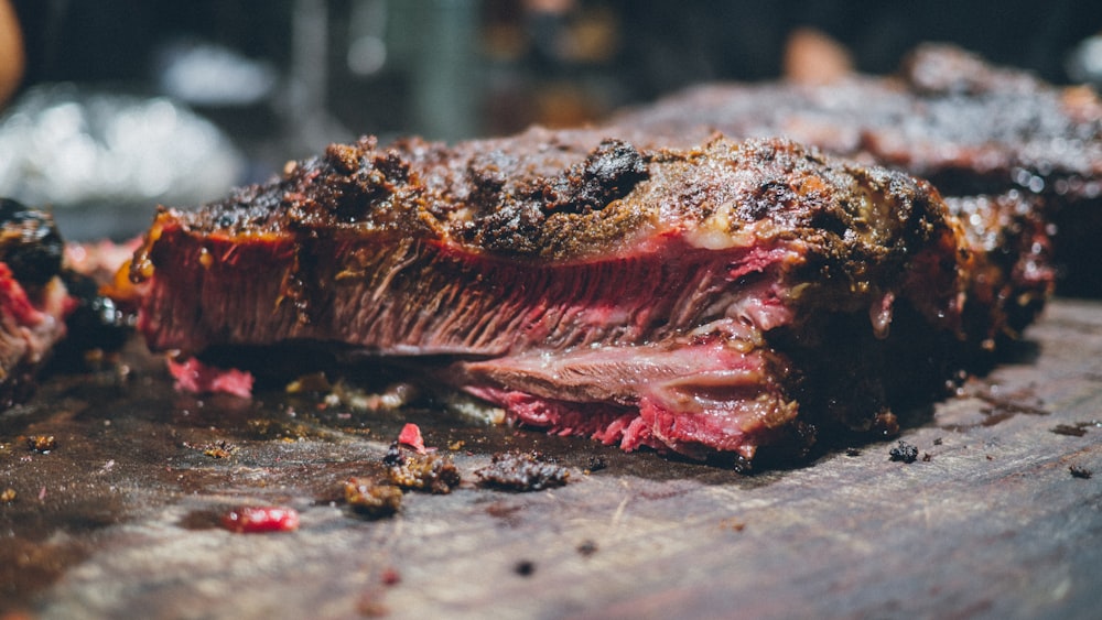 a close up of a piece of meat on a cutting board