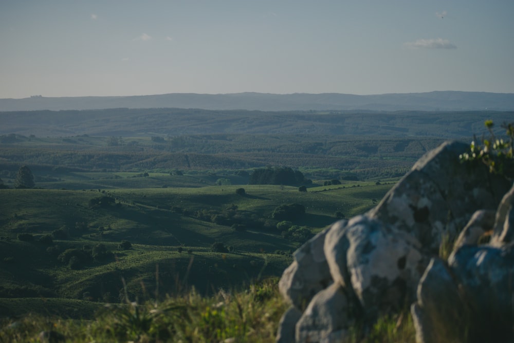 a view of the countryside from a rocky outcropping