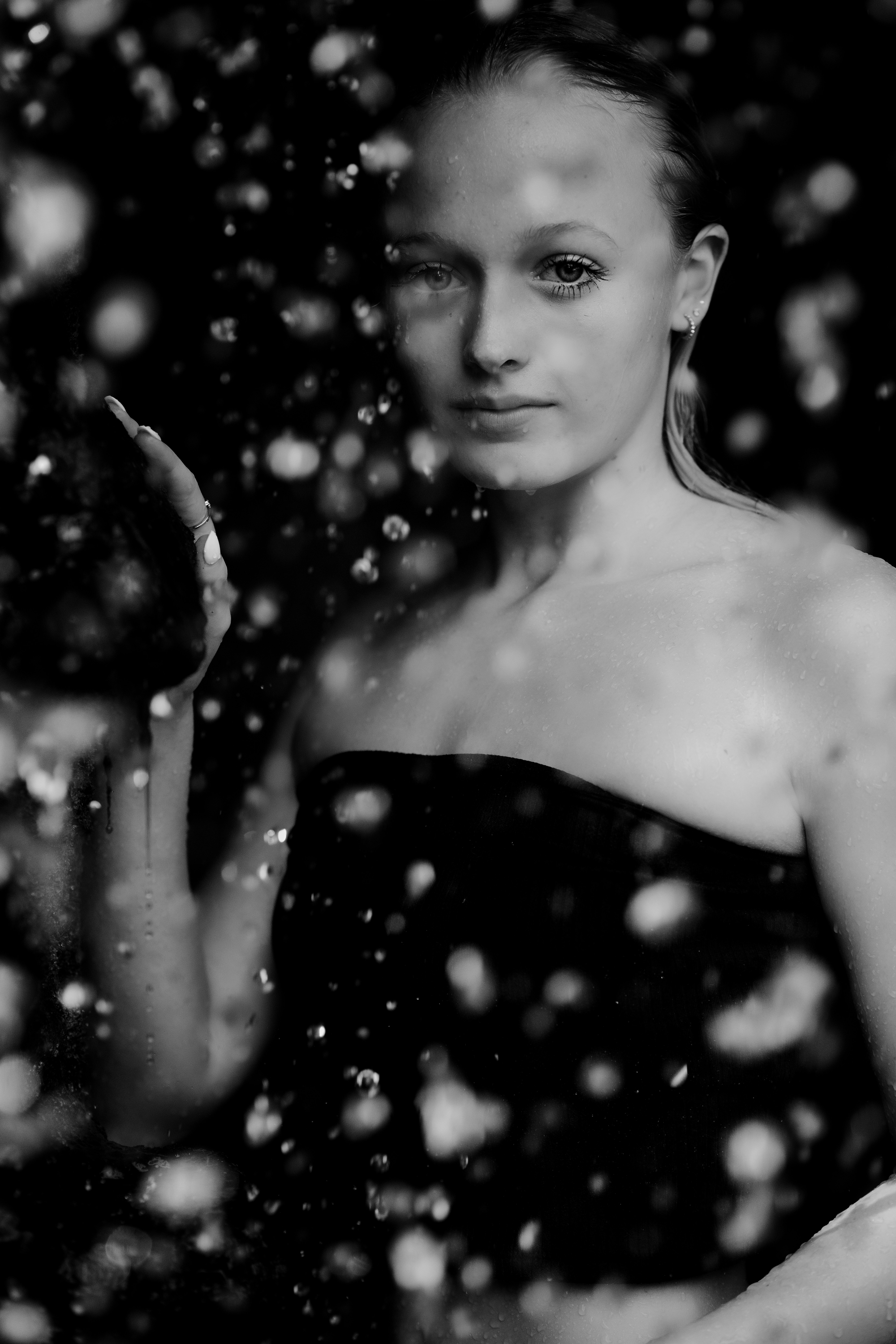 a woman in a strapless dress holding an apple