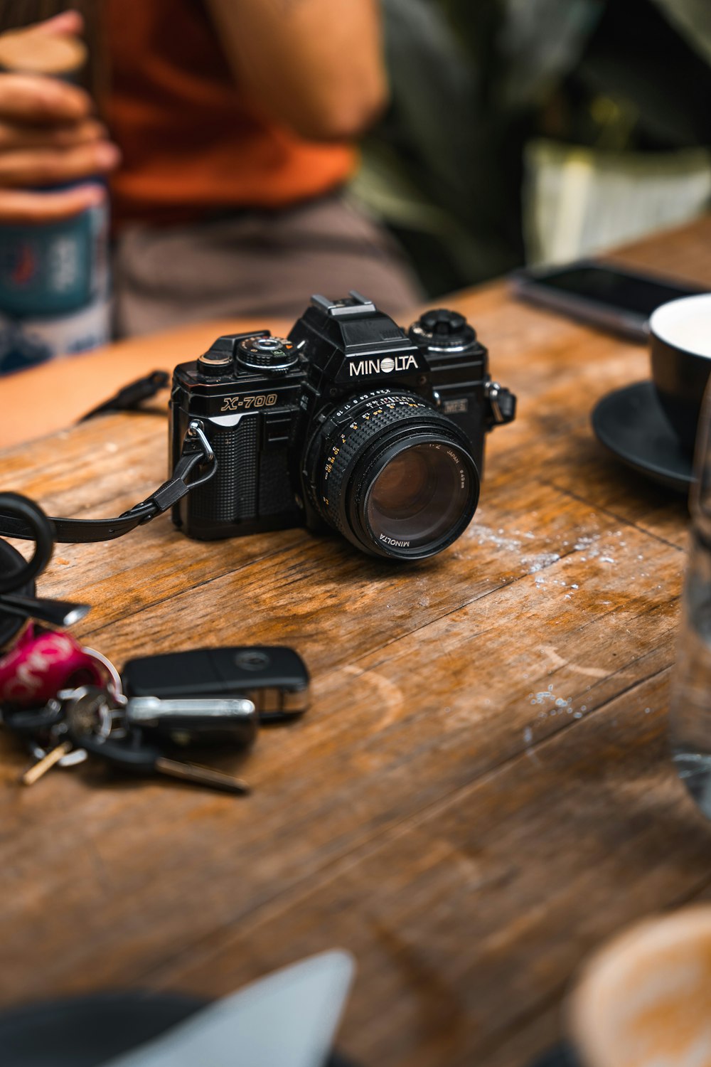 a camera sitting on top of a wooden table