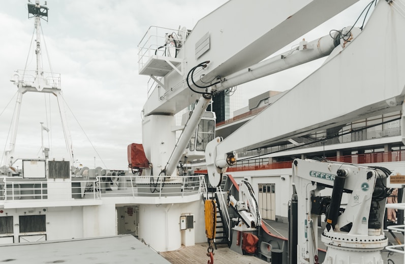 a crane is on the deck of a ship
