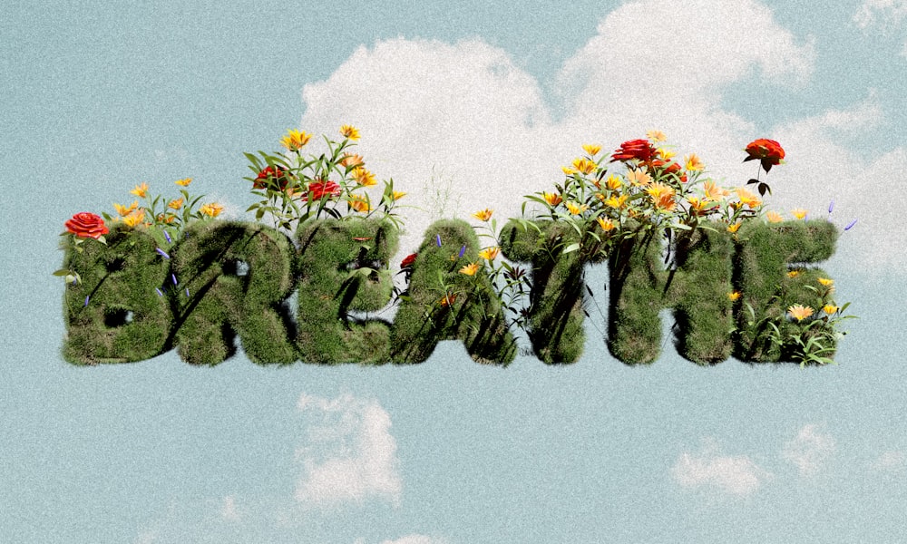 a word made out of grass and flowers