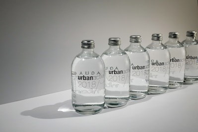 a row of bottles with names on them