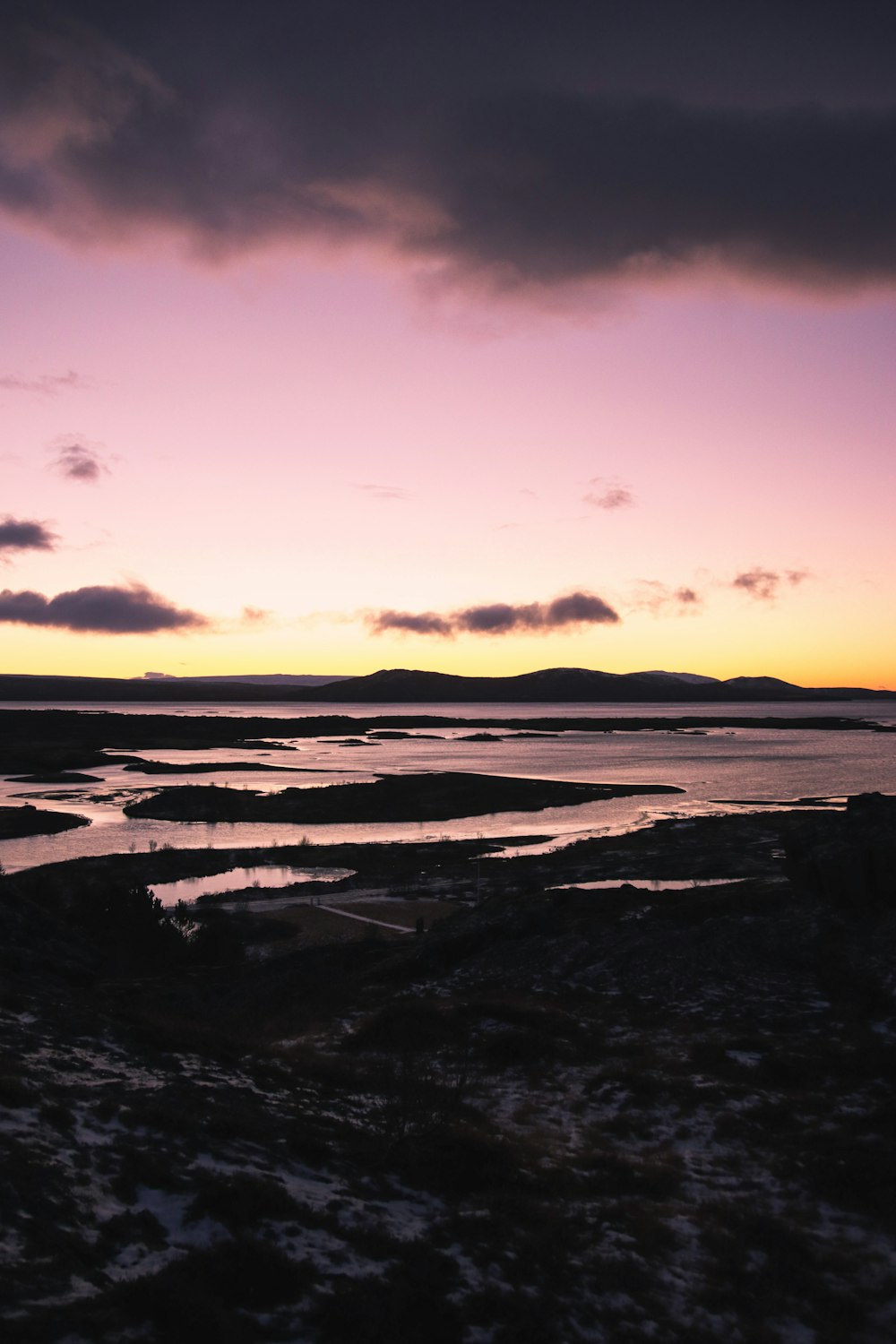 a view of a body of water at sunset