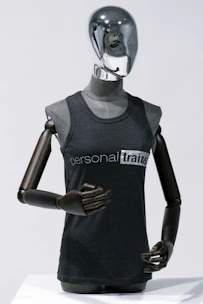 Studio shot of a bodysuit on a mannequin highlighting its minimalist design and premium fabric