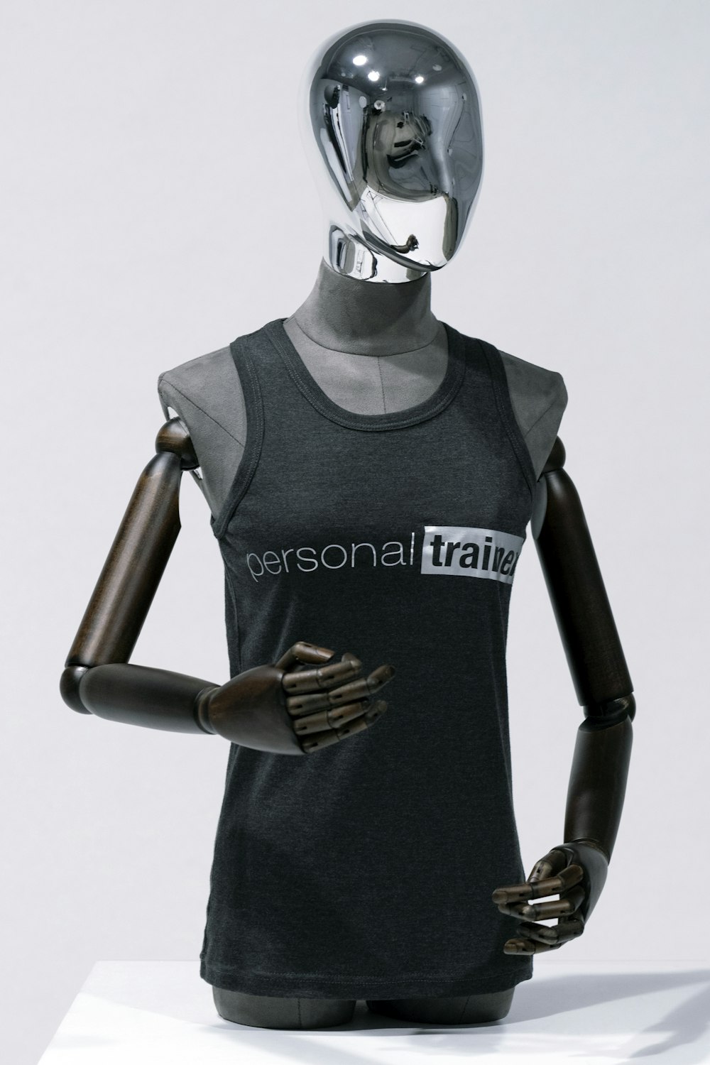 a mannequin wearing a black shirt with the words personal train on it