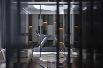 sneak peak of a treadmill through a window - luxury gym design