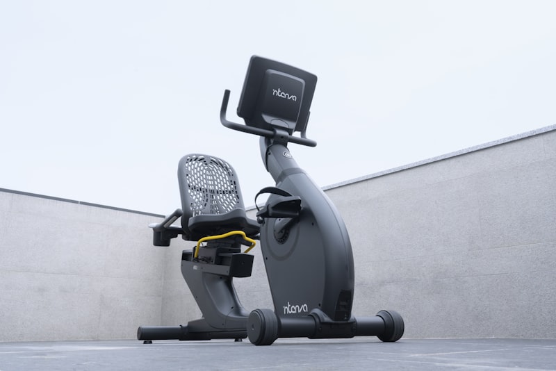 Senior man using a recumbent exercise bike for low-impact cardio at home