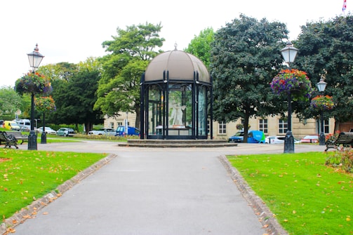 Public park with modern pavilion and green landscaping.