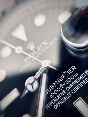 Close-up of a luxury watch being carefully inspected by a professional appraiser.