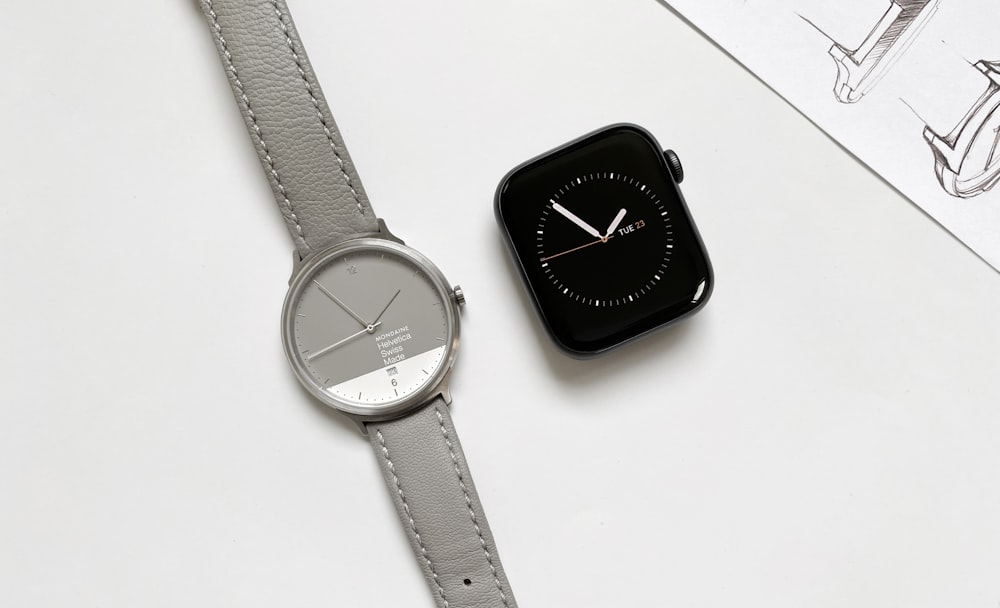 an apple watch sitting on top of a white table