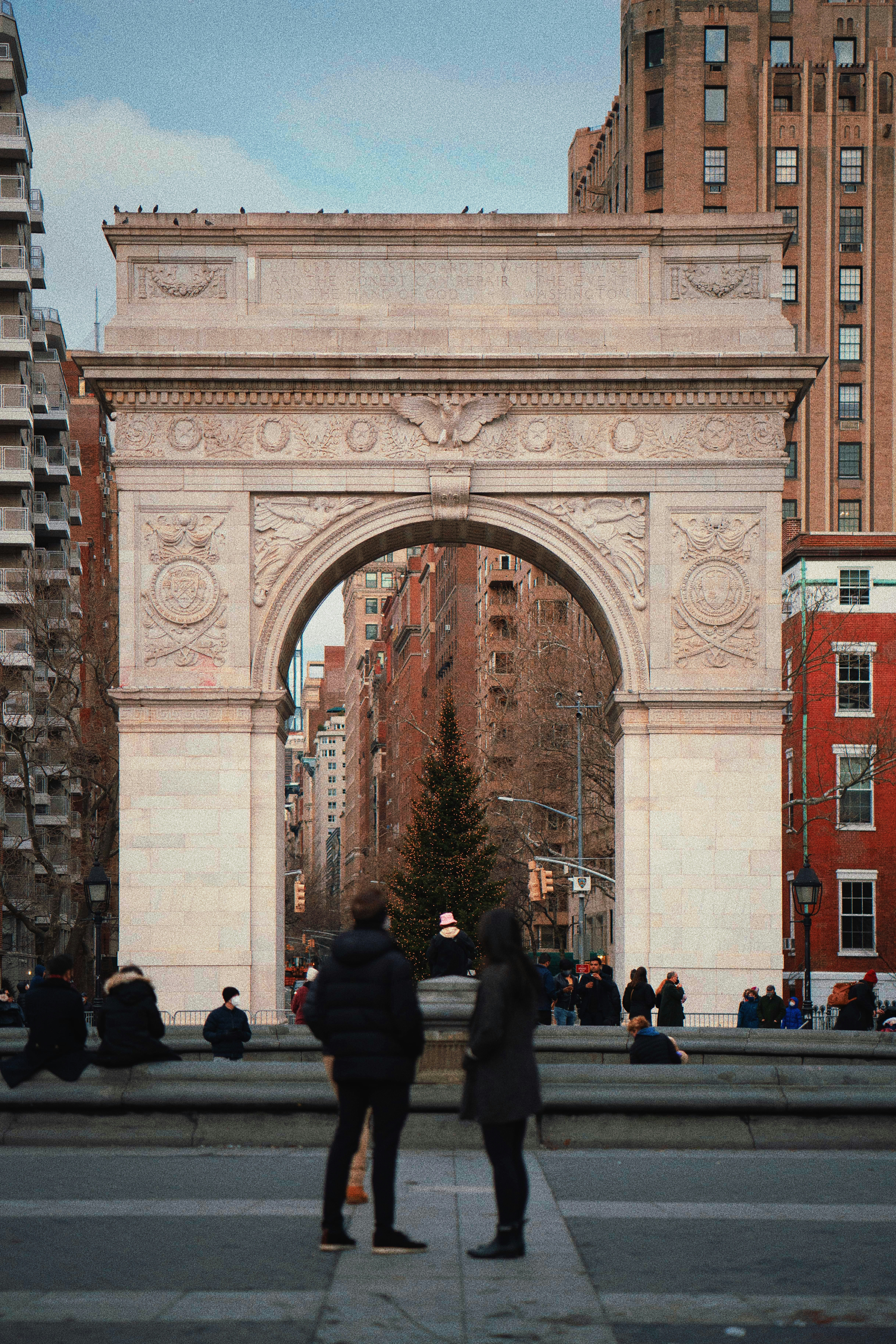 a couple of people that are standing in front of a gate