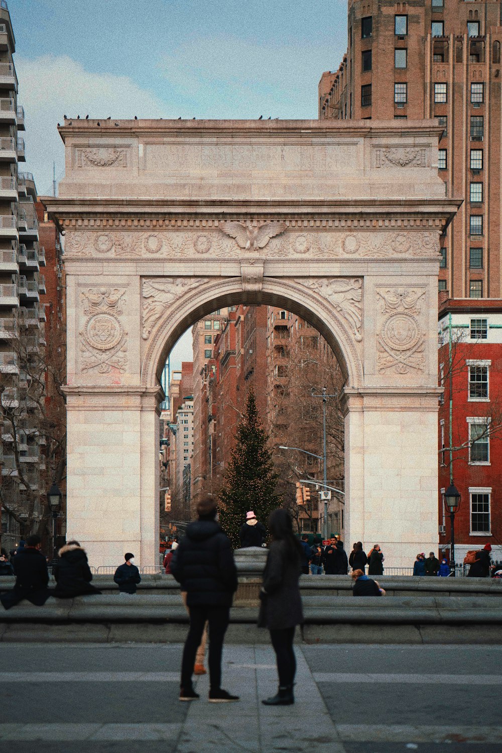 a couple of people that are standing in front of a gate