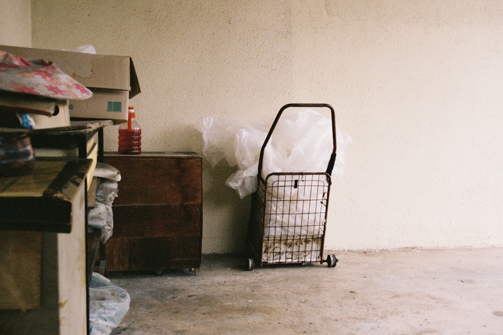 a cart sitting in a room next to a wall