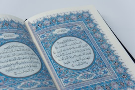 a close up of an open book with arabic writing