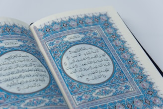 a close up of an open book with arabic writing