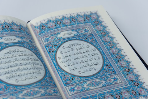 a close up of an open book with arabic writing