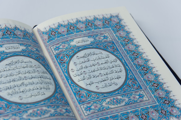 a close up of an open book with arabic writing