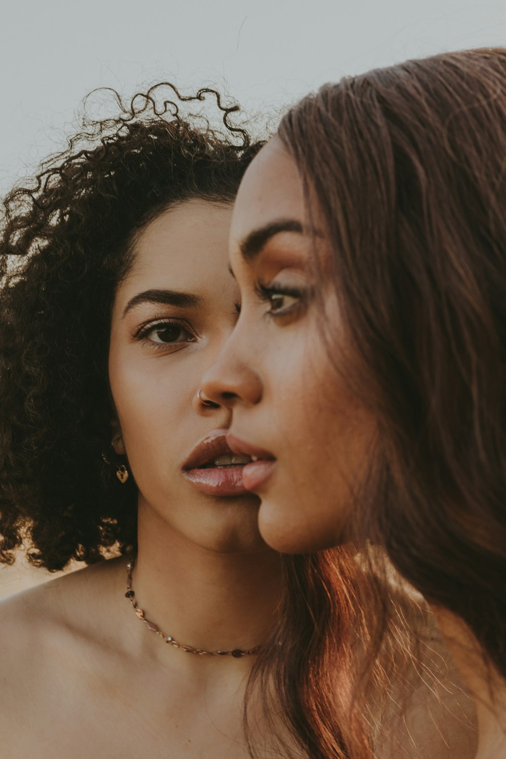 a close up of a person with a necklace on