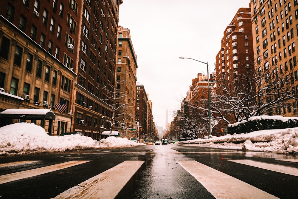 a city street with snow on the ground