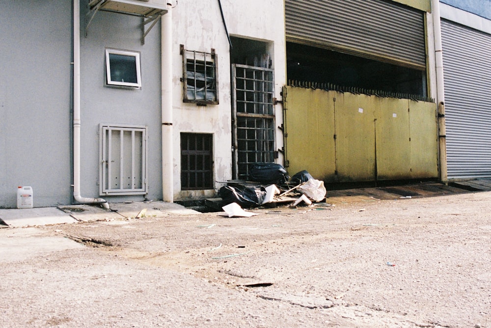 a pile of luggage sitting in front of a building