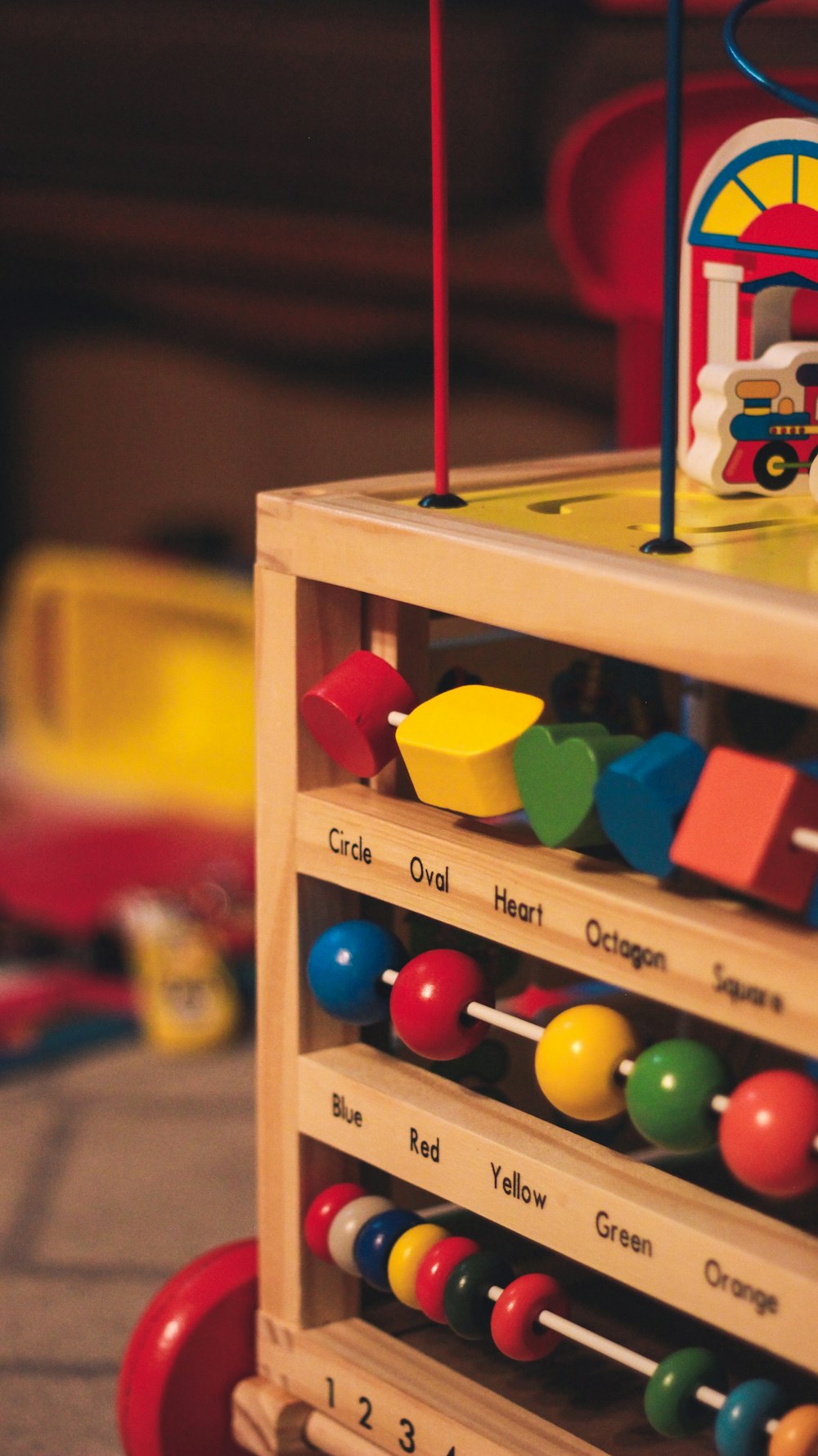 a wooden toy truck with lots of toys on top of it