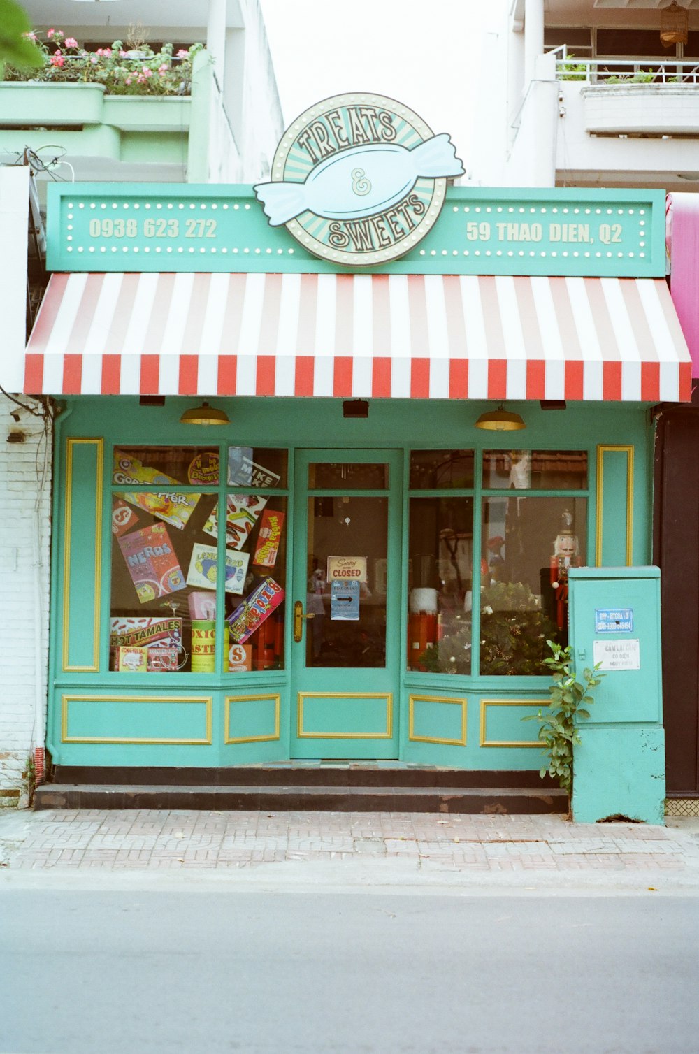 a store front with a striped awning