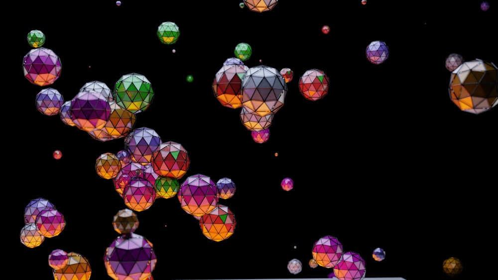 a bunch of colorful balloons floating in the air