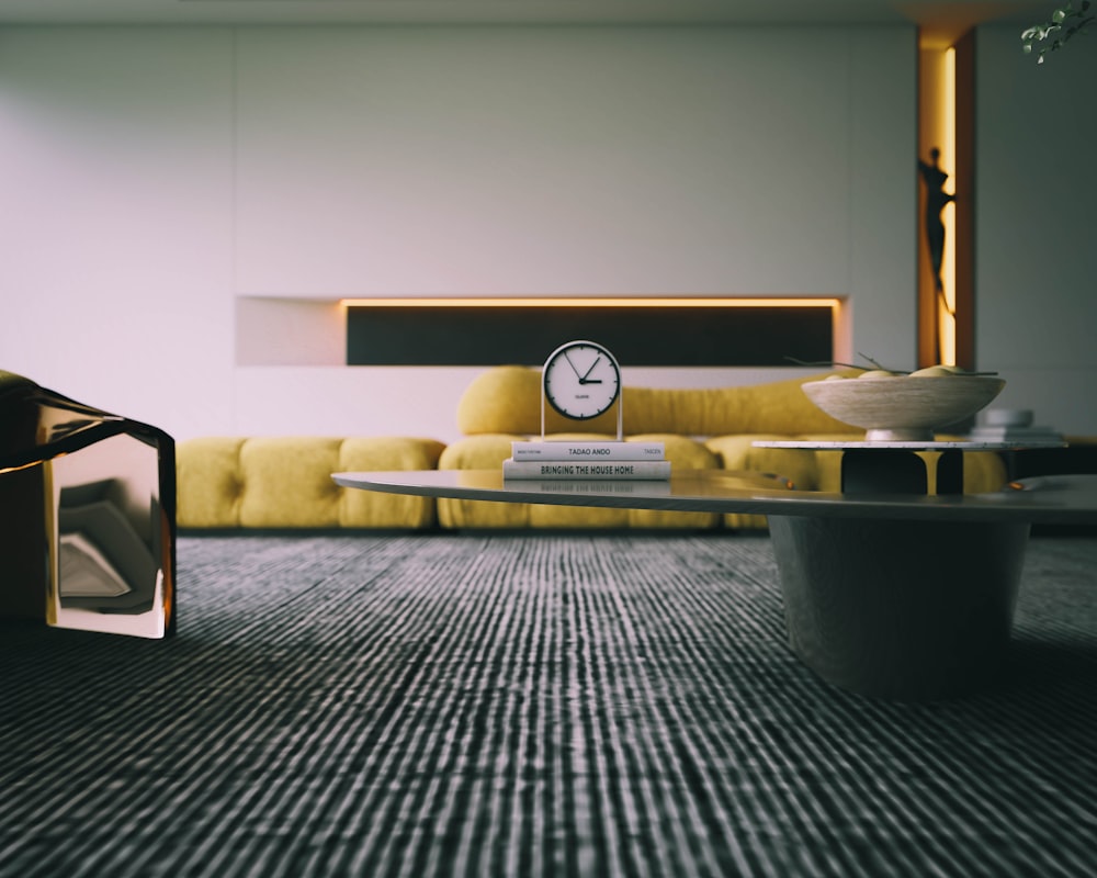 a living room with a yellow couch and a clock