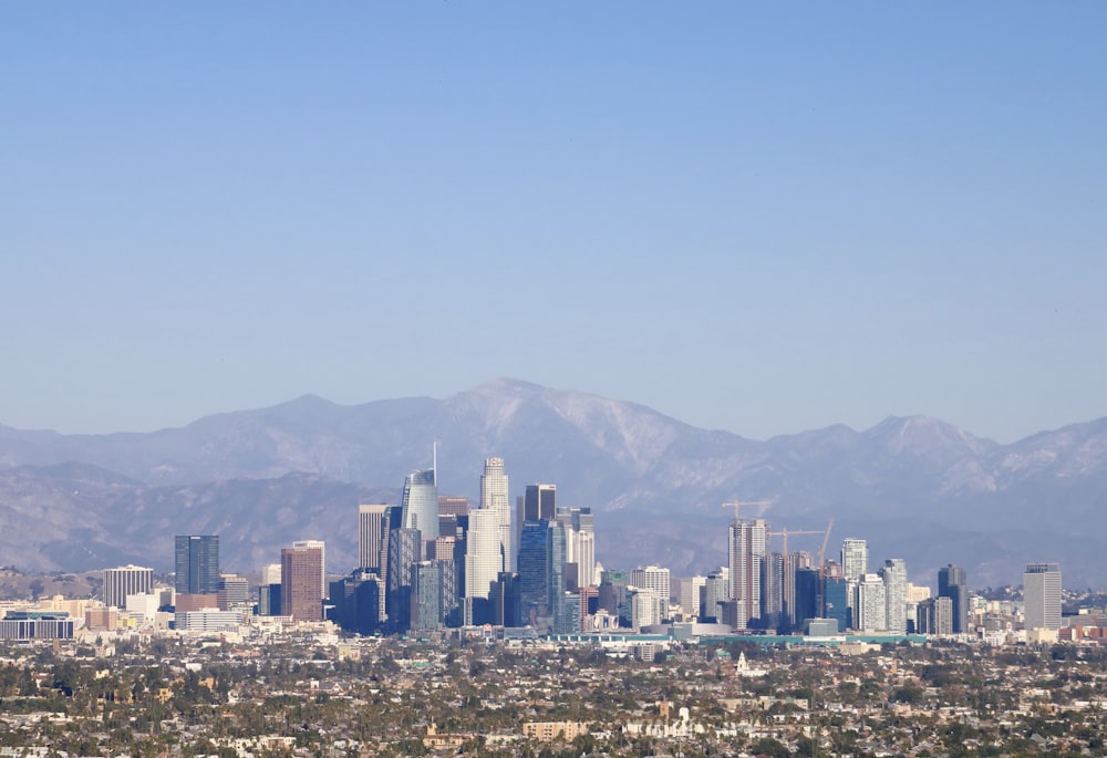 a view of a city with mountains in the background