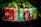 A lineup of various soda cans placed on a dark surface with green foliage in the background. The cans include Coca-Cola, Fanta, Sprite, A&W, and Schweppes among others, each displaying vibrant branding and distinct color schemes.