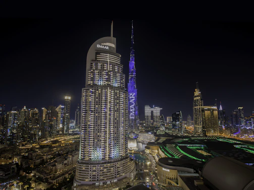 Emad reviewing legal documents in a modern office with a view of the Dubai skyline.