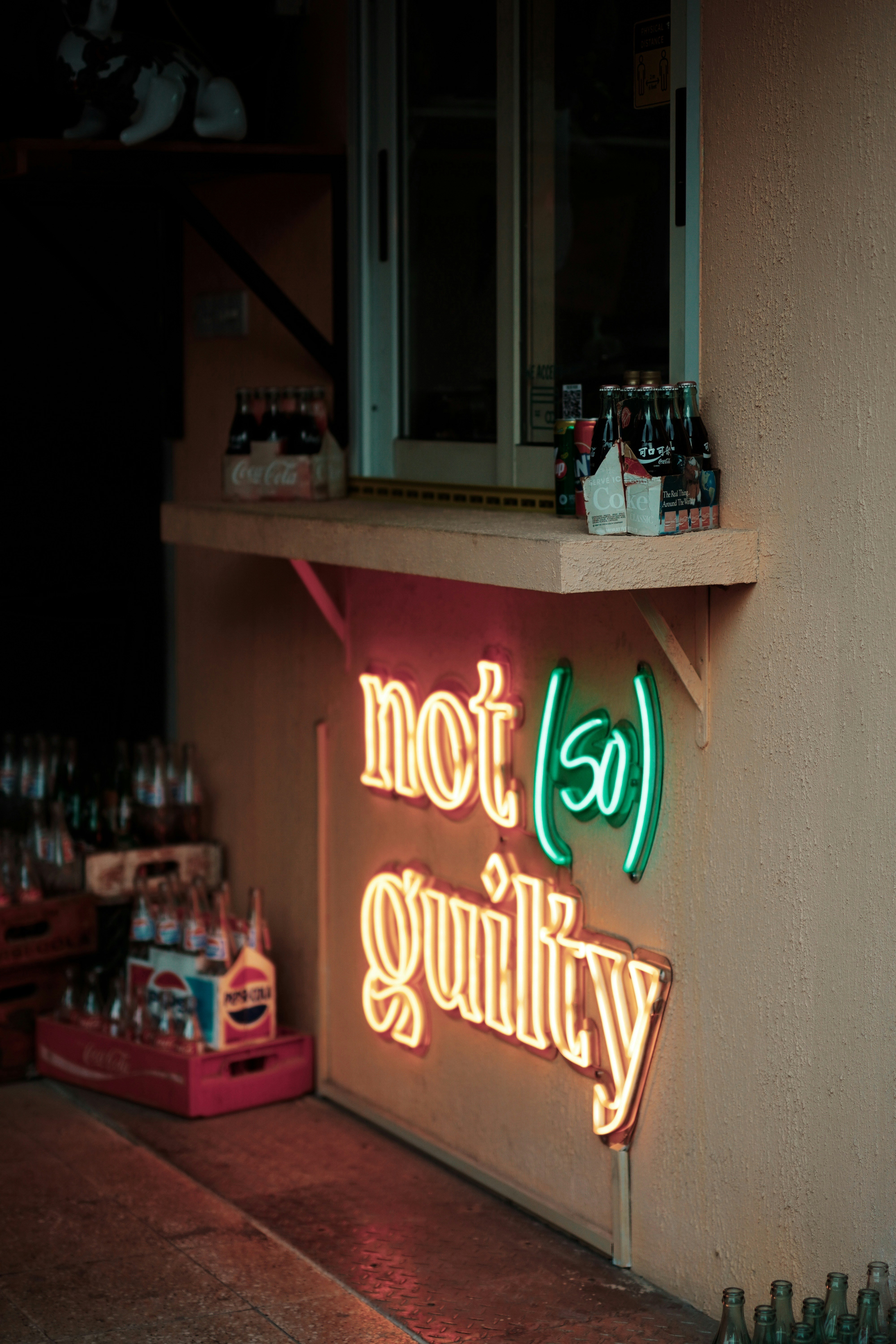 A neon sign on the side of a building