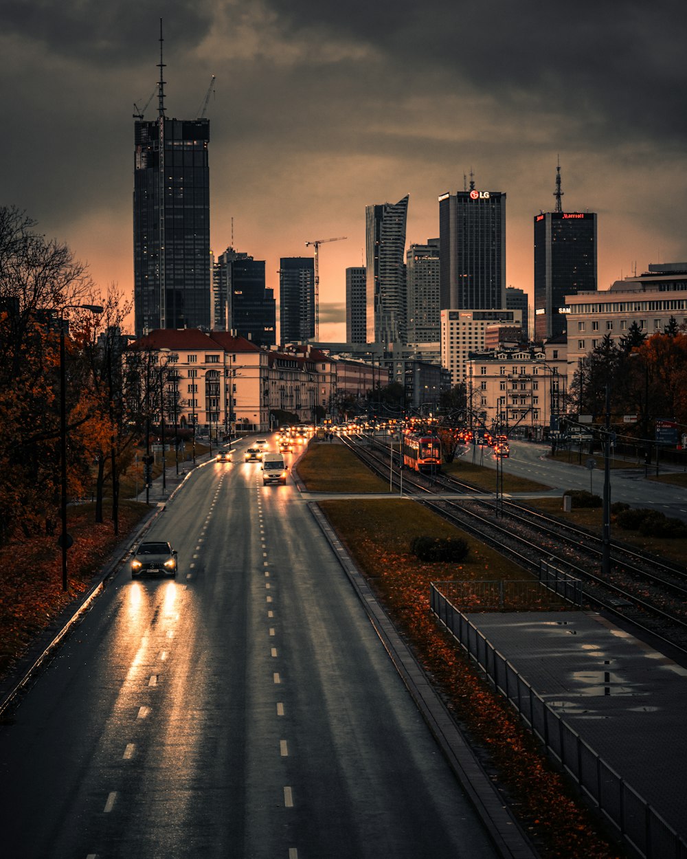 a city street with cars driving down it