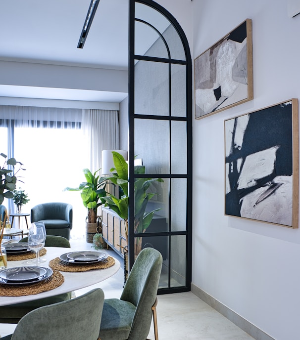 a dining room with a table and chairs