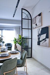 a dining room with a table and chairs