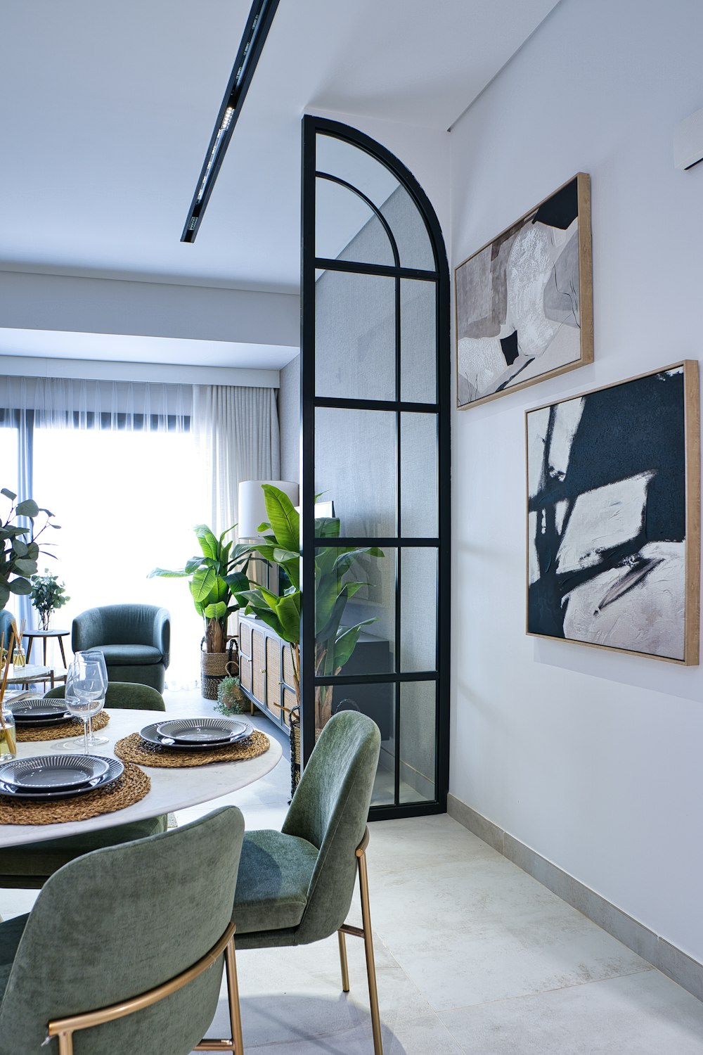 a dining room with a table and chairs